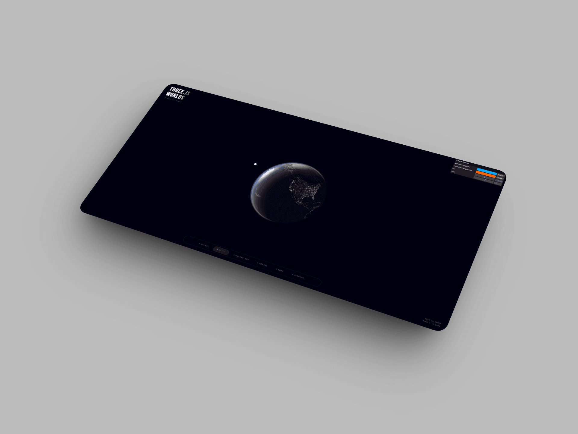 Three JS Worlds project shown on a laptop mockup with a particle boat scene.